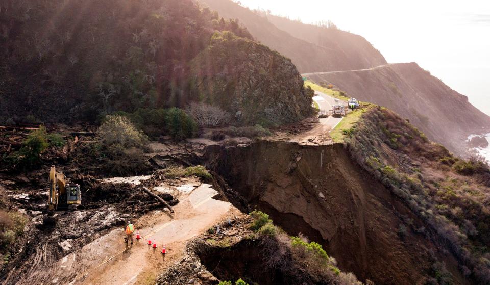 <p>Construction crews work on a section of Highway 1, which collapsed into the Pacific Ocean near Big Sur, California on January 31, 2021. Heavy rains caused debris flows of trees, boulders and mud that washed out a 150-foot section of the road. </p> ((Photo by JOSH EDELSON / AFP) )