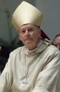 FILE PHOTO: Archbishop of Washington Theodore E. McCarrick listens during a Youth Mass prior to an anti-abortion rally in Washington, U.S., January 22, 2001. REUTERS/Brendan McDermid/Files