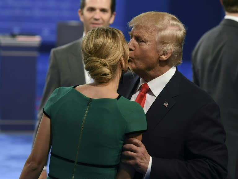 Republican presidential nominee Donald Trump kisses his daughter Ivanka following the second presidential debate at Washington University on October 9, 2016