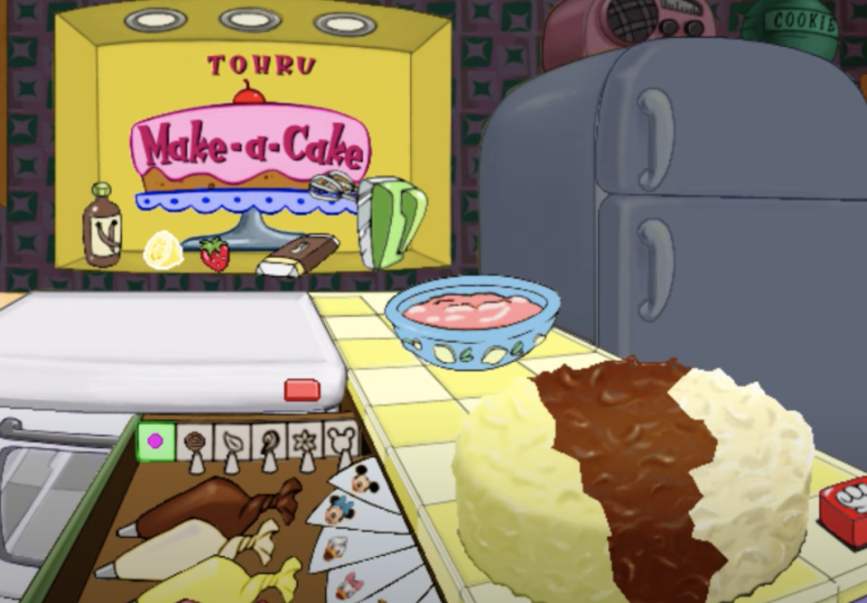 Animated kitchen scene from a video game with a "Make-a-Cake" mixer, ingredients on counter, and recipes in a drawer