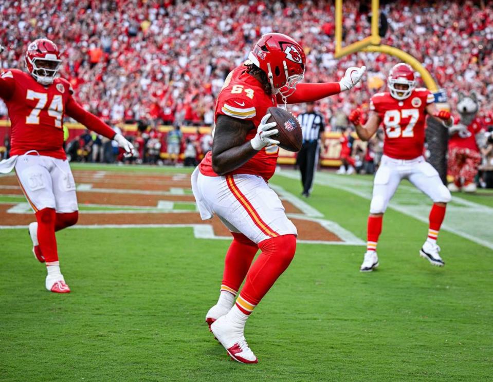 Kansas City Chiefs offensive tackle Wanya Morris (64) dances with teammates offensive tackle Jawaan Taylor (74) and tight end Travis Kelce (87) after Morris pulled in a pass for touchdown in the third quarter against the Cincinnati Bengals Sunday, Sept. 15, 2024, at GEHA Field at Arrowhead Stadium.