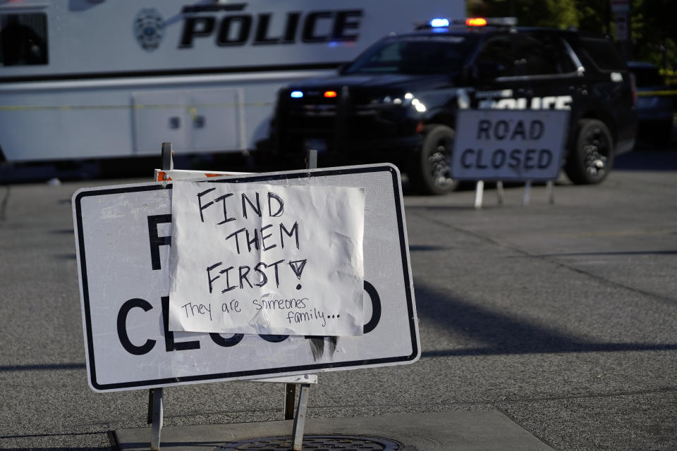 A sign is posted at the scene where an apartment building partially collapsed on Sunday afternoon, Tuesday, May 30, 2023, in Davenport, Iowa. Five residents of the six-story apartment building that partially collapsed remained unaccounted for and authorities feared at least two of them might be stuck inside rubble that was too dangerous to search. (AP Photo/Erin Hooley)