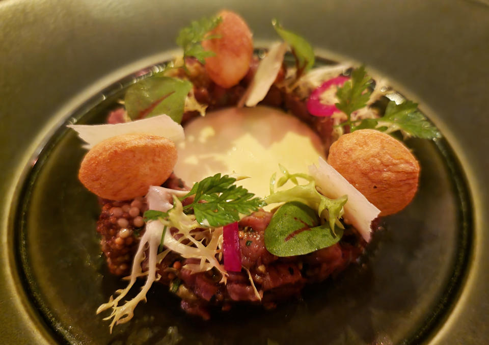 The beef tartare and garlic toast at Bâtard, one of the stops on Finklestein's world-record journey. (Courtesy Eric Finkelstein)