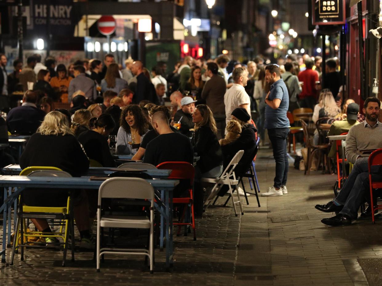 People outside the Blue Posts pub in Berwick Street, Soho, London (PA)