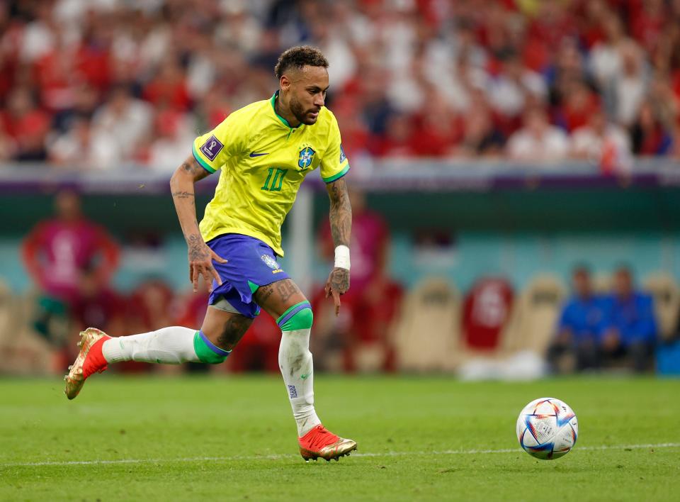 Brazil forward Neymar dribbles against Serbia during a group stage match of the 2022 World Cup at Qatar.
