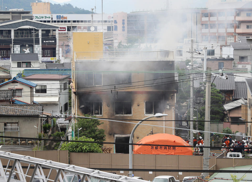 Smoke comes out from the animation company building after a fire in Kyoto (Photo credit should read JIJI PRESS/AFP/Getty Images)