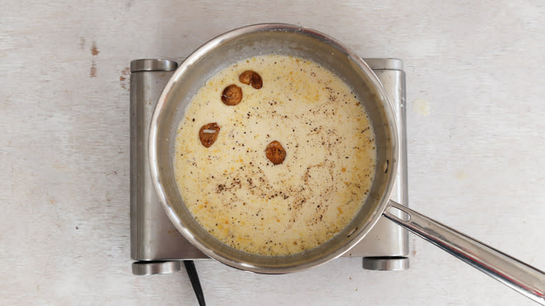 roasted garlic cream sauce in saucepan