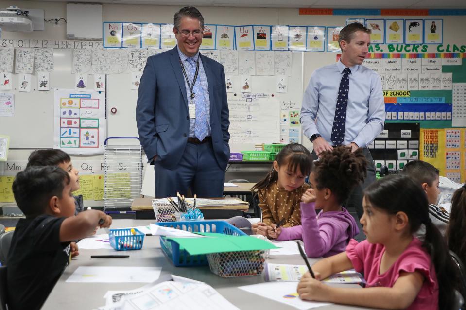 Palm Springs Unified School District superintendent Tony Signoret, left, and Rio Vista Elementary School principal Aaron Tarzian observe a kindergarten class at the school in Cathedral City, Calif., Dec. 12, 2023.