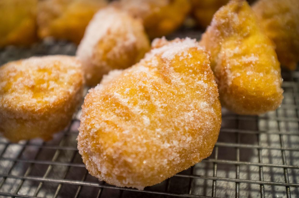 Fried sweet Chinese doughnuts on buffet server tray