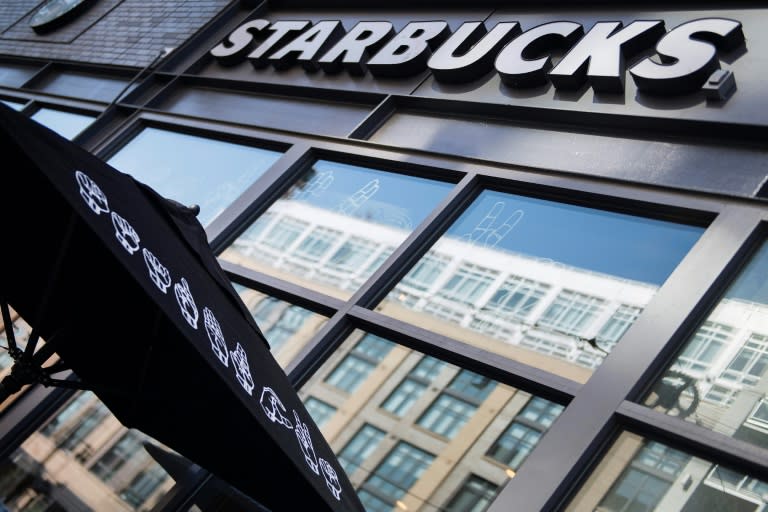 Starbucks is written in sign language on an umbrella outside the new "signing store" in Washington