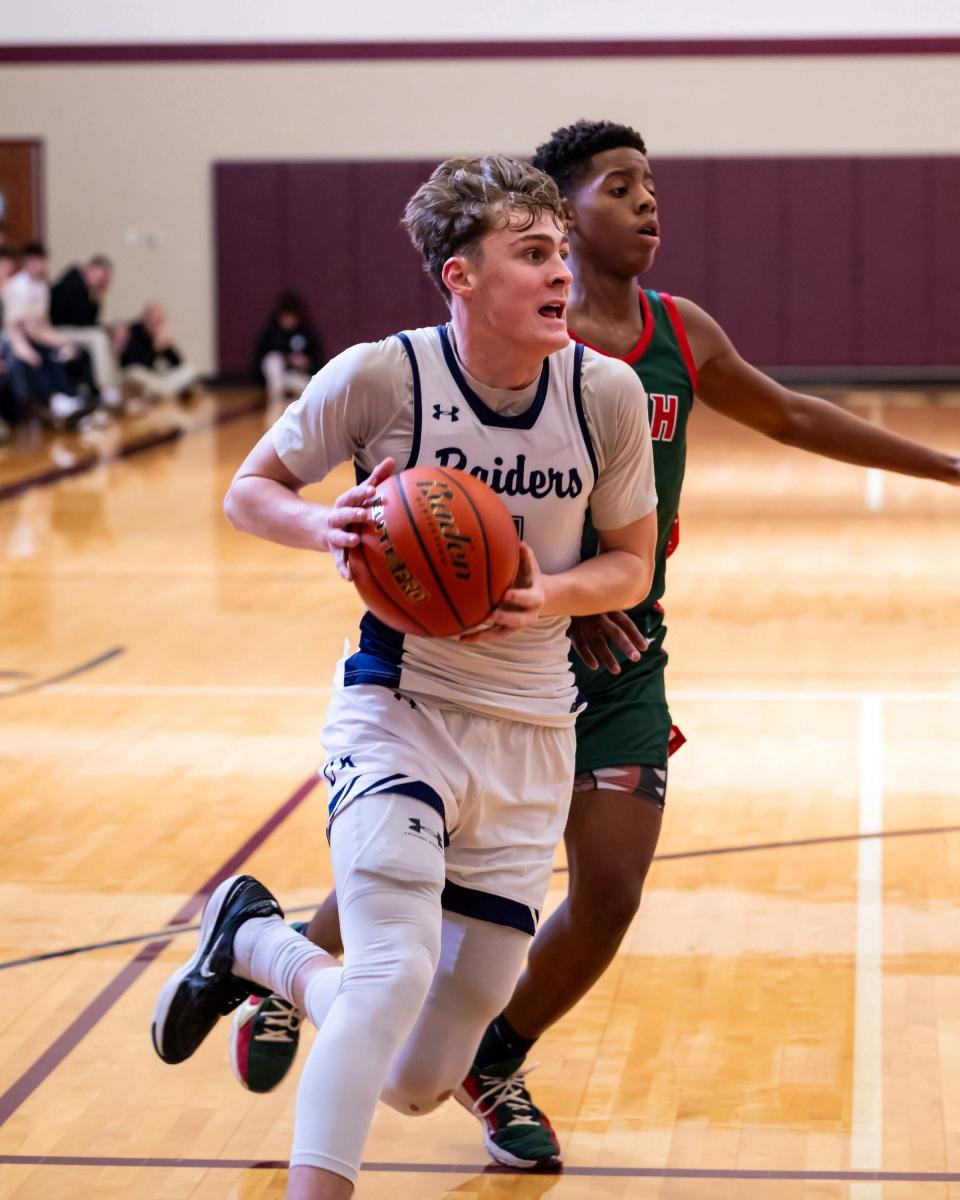 Peyton Dulin drives for Cedar Ridge in a game against The Woodlands. Round Rock High Men's Basketball hosted the third annual William Roberts Memorial tournament on December 28th - 30th, 2023.