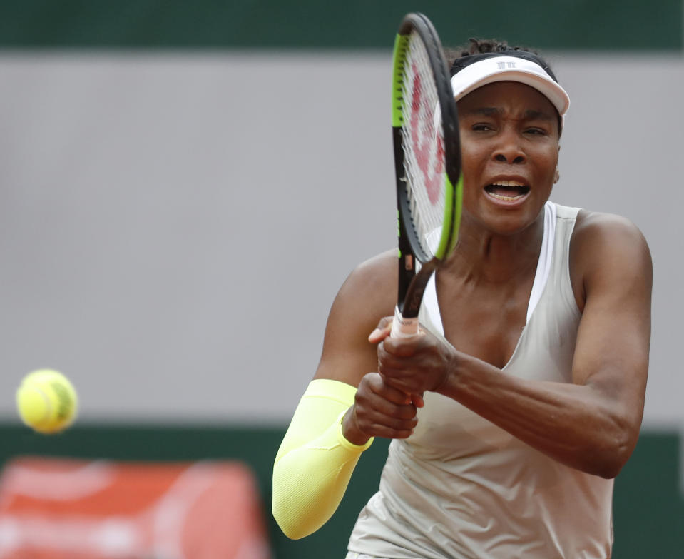 Venus Williams of the U.S. plays a shot against Ukraine's Elina Svitolina during their first round match of the French Open tennis tournament at the Roland Garros stadium in Paris, Sunday, May 26, 2019. (AP Photo/Pavel Golovkin)