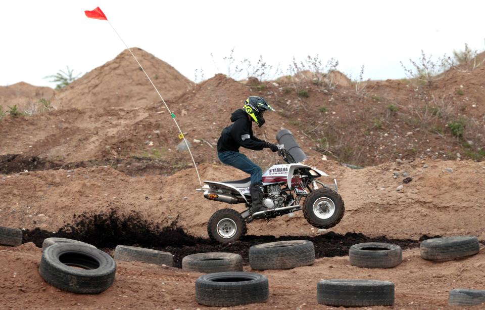 Allen Roof, 15 of Dundee, rides his ATV around the newly opened youth course at Holly Oaks ORV Park in Holly on Saturday, May 20, 2023.  
The off road park held an event where kids on various recreational vehicles could ride for free to help promote the new section of the off road course.