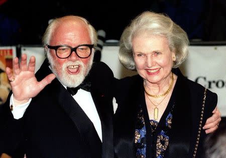Richard Attenborough arrives at the Royal premiere of his film "In Love and War" with his wife Sheila Sim in London, in this file picture taken February 12, 1997. REUTERS/Paul Hackett