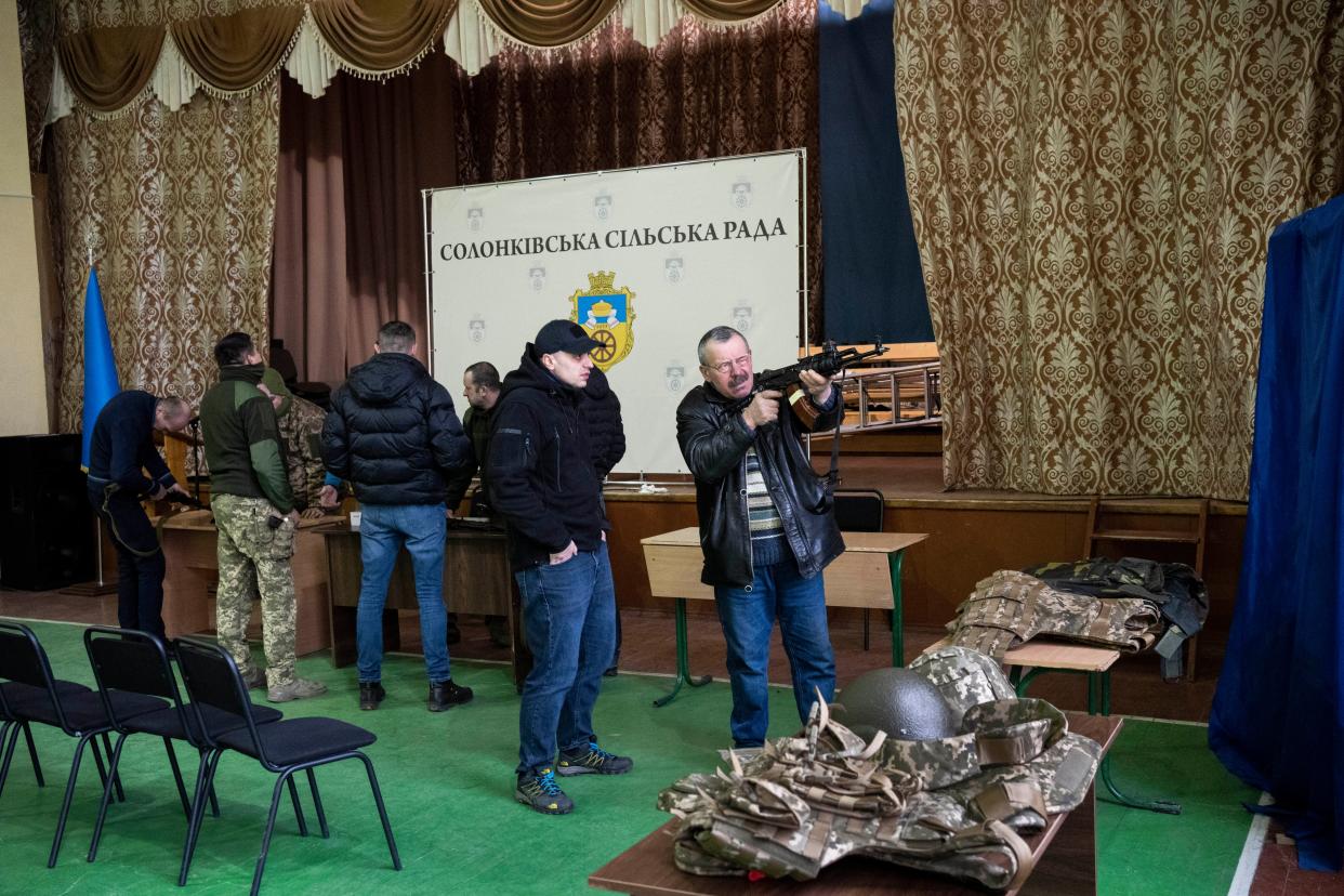 Ukrainian civilians receive weapons training in the outskirts of Lviv, western Ukraine, Monday, March 7, 2022. Russia's invasion of Ukraine has entered its 12th day following what Ukrainian authorities described as increased shelling of encircled cities and another failed attempt to evacuate civilians from the port of Mariupol.