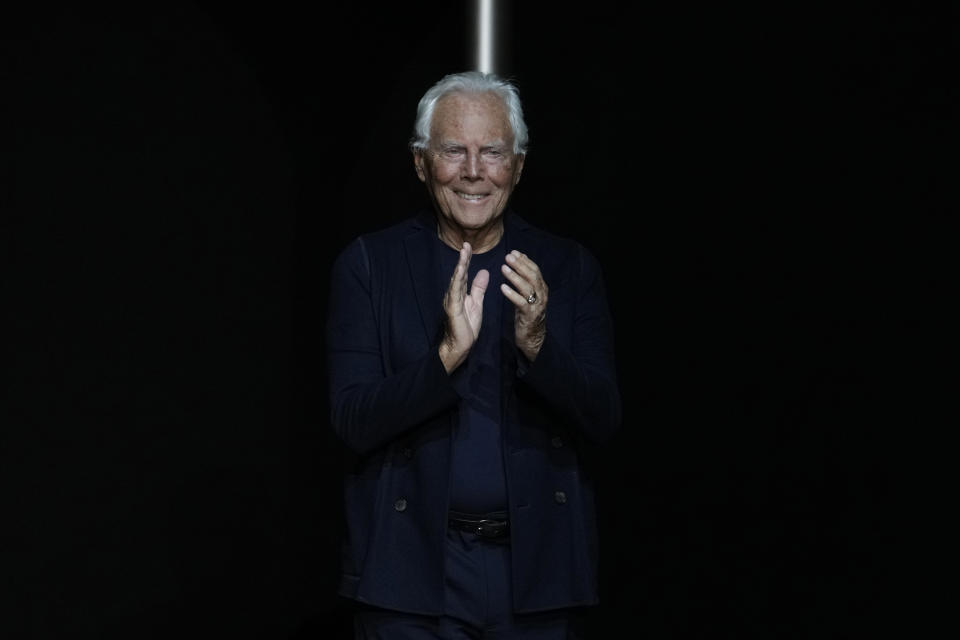 Designer Giorgio Armani accepts applause at the end of the Emporio Armani men's Spring Summer 2024 collection presented in Milan, Italy, Saturday, June 17, 2023. (AP Photo/Luca Bruno)