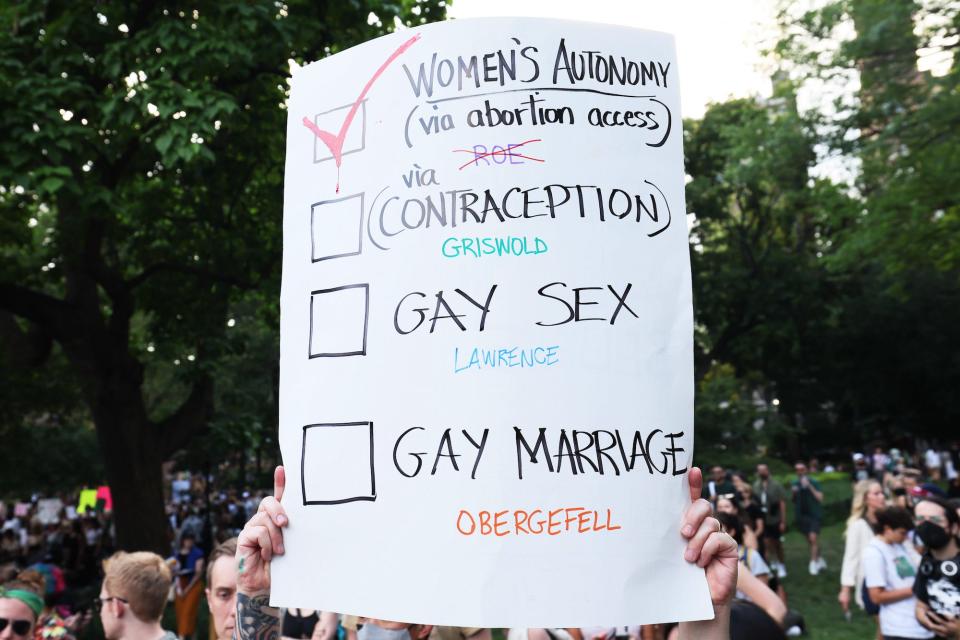 A person holds up a sign as they join people to protest the Supreme Courts 6-3 decision in the Dobbs v. Jackson Women’s Health Organization at Washington Square Park on June 24, 2022 in New York City.