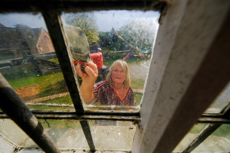 A homeowner has completed the ultimate lockdown DIY project at one of Britain's last fully-working windmills - after using a cherry picker to paint the sails by hand. Jeanette McGarry, 58, painstakingly spent three weeks touching up the paintwork on the gigantic five tonne sails as part of a refurbishment of historic Berkswell Windmill. The 70ft tall Grade II-listed building has been standing for nearly 200 years in the village of Balsall Common, West Mids., and was bought by Jeannette in 2005. She then spent £200,000 restoring the 19th century four-bladed tower mill to its former glory with the help of English Heritage after it fell into a state of disrepair.