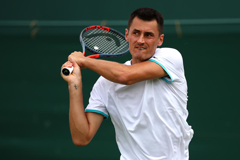 Bernard Tomic drew criticism and lost his paycheck for a 58-minute loss in the opening round at Wimbledon. (Getty)