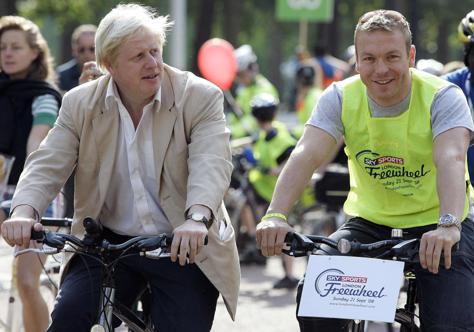 London Mayor Boris Johnson rides next to Olympic gold medallist Chris Hoy (right) during the 2008 London Freewheel event in London. 