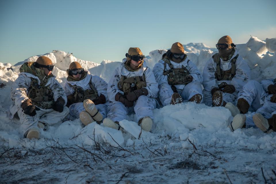 U.S. Soldiers, attached to 3rd Battalion, 509th Infantry Regiment, 2nd Infantry Brigade Combat Team, 11th Airborne Division, tasked with representing the opposing force with modified uniforms, await transit to the next battle position during Joint Pacific Multinational Readiness Center 24-02 at Donnelly Training Area, Alaska, Feb. 10, 2024.