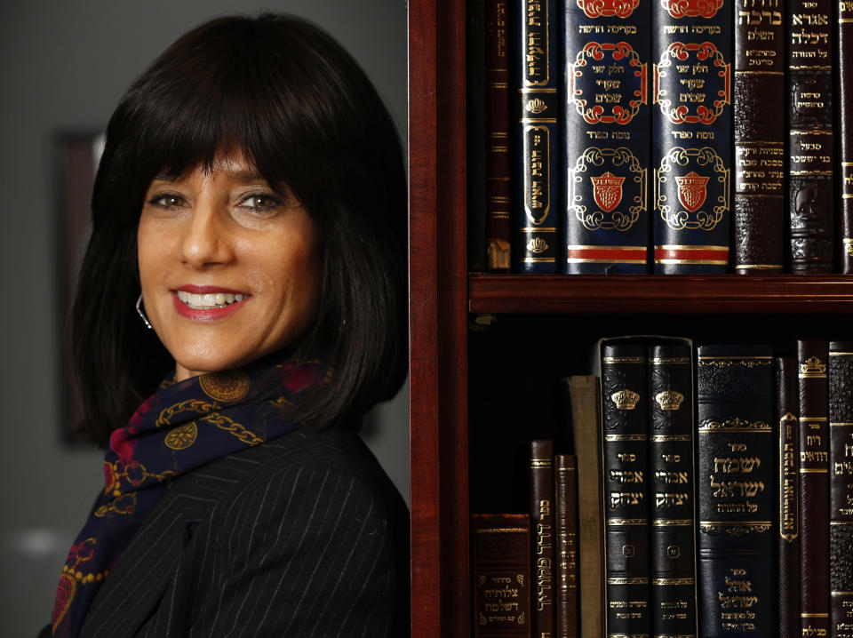 In this Thursday, Dec. 29, 2016 photo, Rachel Freier poses for a picture at her law office in the Borough Park section of Brooklyn, New York. In some ways, Freier has an ordinary background for a newly elected civil court judge: She's a real estate and commercial lawyer who volunteers in family court and in her community, where she even serves as a paramedic. But then there's all the extraordinary about Freier, who starts work in a Brooklyn courthouse Tuesday, Jan. 3, 2017, as apparently the first woman from Judaism's ultra-Orthodox Hasidic community to be elected as a judge in the United States. (AP Photo/Seth Wenig)