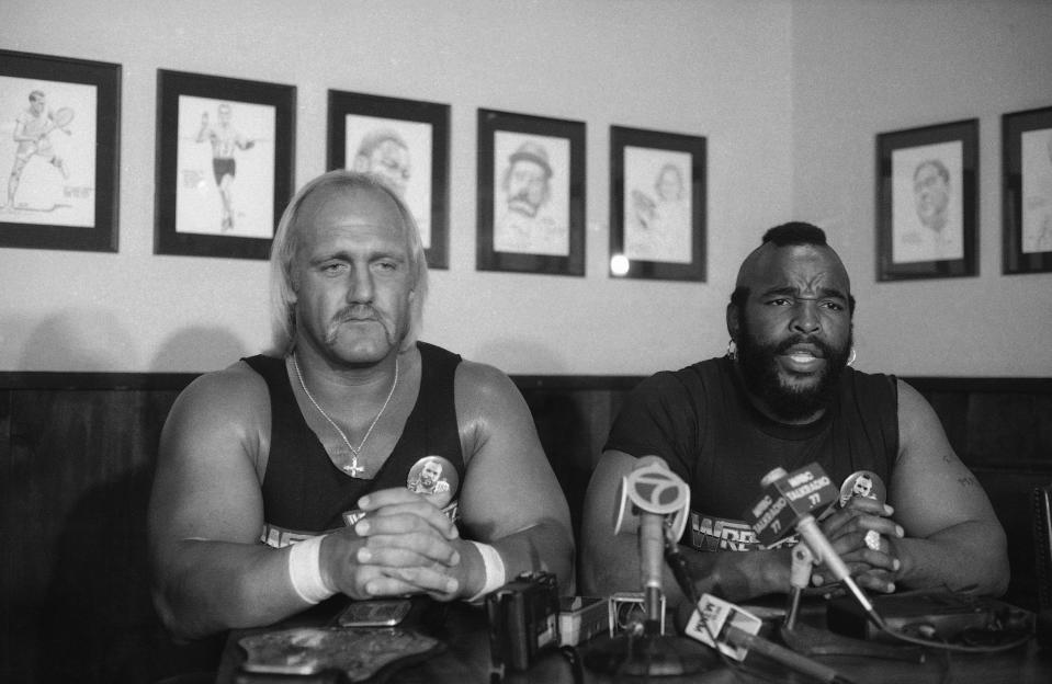 FILE - World Wrestling Federation heavyweight champion Hulk Hogan, left, and Mr. T. appear at a news conference on Sunday, March 18, 1985, in New York's Madison Square Garden. From the start, WrestleMania was born to be different. (AP Photo/Corey Struller)