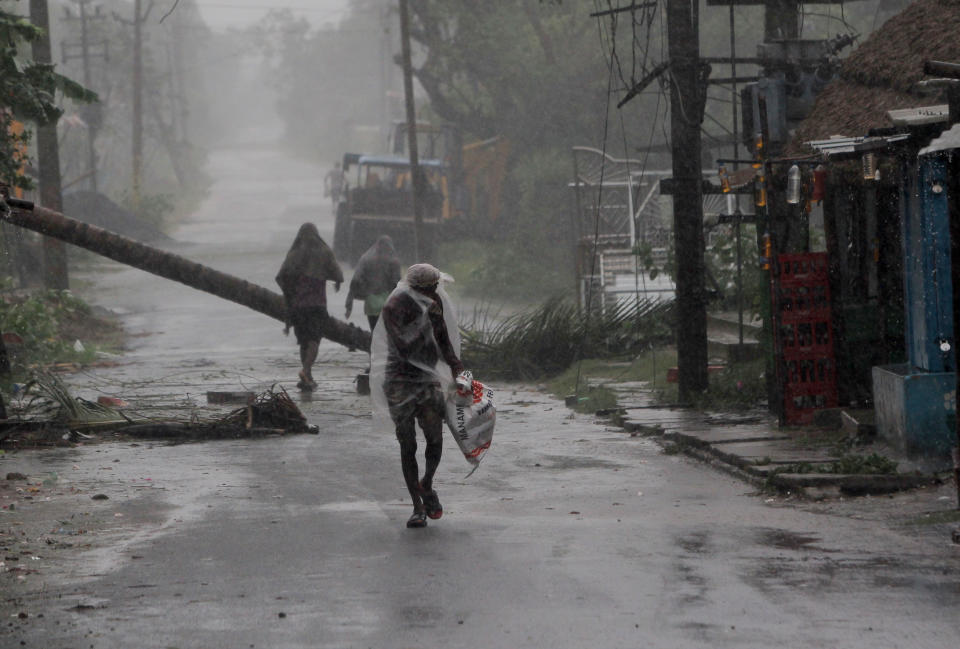 People are seen at the Chandabali and Dhamra area of Bhadrak district, 160 km away from the eastern Indian state Odisha's capital city as the Cyclone 'Amphan' cross the Bay of Bengal Sea's eastern coast making devastation on the cyclonic weather wind and rain and make landfall on the boarder of West Bengal and Bangladesh on May 20, 2020. (Photo by STR/NurPhoto via Getty Images)