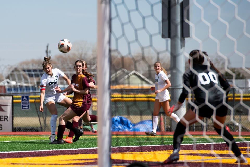 Fossil Ridge's Abby Ballek watches a shot on goal during a girls soccer match on Saturday, March 23, 2024, at Windsor High School in Windsor, Colo.