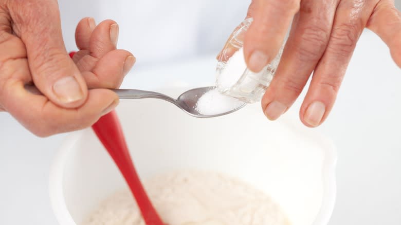 Pouring spoon of sugar dough