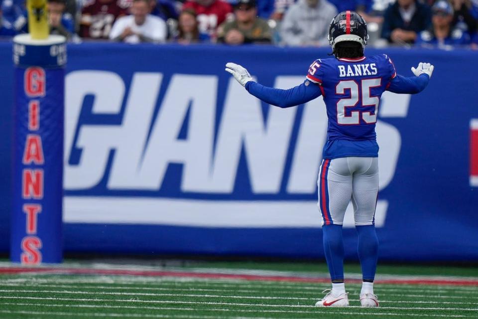 New York Giants cornerback Deonte Banks (25) dances on the field during an NFL football game against the Washington Commanders, Sunday Oct. 22, 2023, in East Rutherford, N.J. (AP Photo/Bryan Woolston)