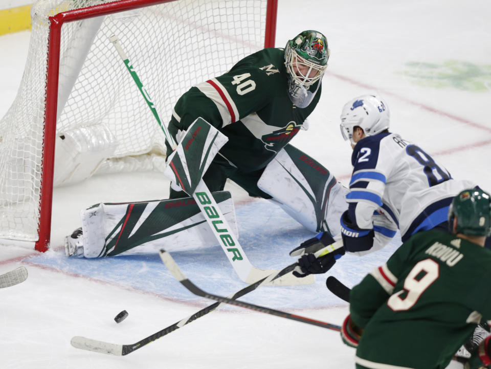 Minnesota Wild goalie Devan Dubnyk (40) makes a save on a shot by Winnipeg Jets forward Mason Appleton (82) in the second period of an NHL hockey game Sunday, Sept. 29, 2019, in St. Paul, Minn. (AP Photo/Andy Clayton-King)