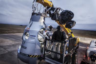 Pilot Felix Baumgartner of Austria stands on the step of his capsule during the preparation for the final manned flight of Red Bull Stratos in Roswell, New Mexico, on Oct. 6, 2012.