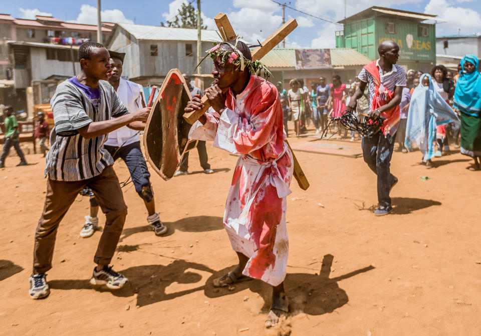 Christian devotees reenact the Way of the Cross, or Jesus Christ's passion, during a Good Friday commemoration in Kibera, Nairobi, on April 19, 2019. (BRIAN OTIENO via Getty Images)