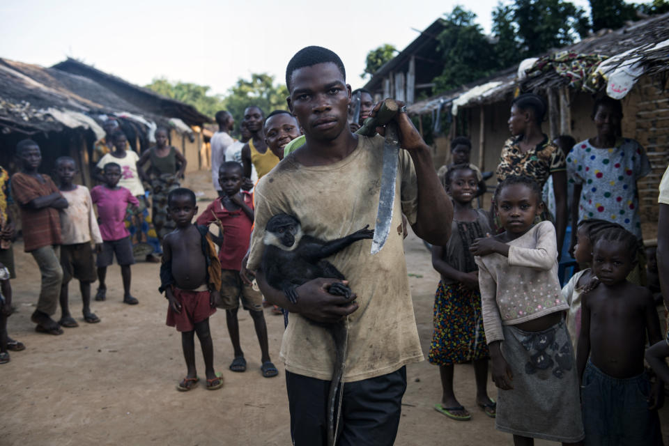 A resident of Salambongo with a monkey he caught and hopes to domesticate and sell. (Photo: Neil Brandvold/DNDi)