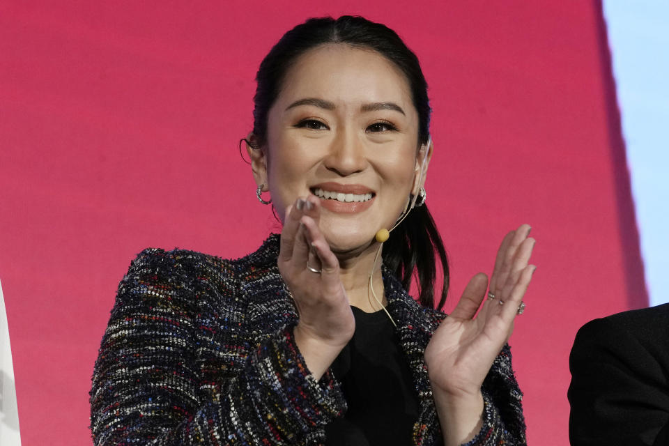 The daughter of Thailand's former Prime Minister Thaksin Shinawatra, Paetongtarn Shinawatra applauds after a Pheu Thai party general assembly meeting to prepare for the next election in Bangkok, Thailand, Tuesday, Dec. 6, 2022. Shinawatra promised a new era of social equality Tuesday, saying if her party is elected to power in next year's election it will bring an end to poverty in the Southeast Asian nation. (AP Photo/Sakchai Lalit)