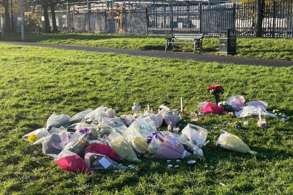 Floral tributes left at the scene at Stowlawn playing fields in Wolverhampton where Shawn Seesahai was stabbed (PA Archive)