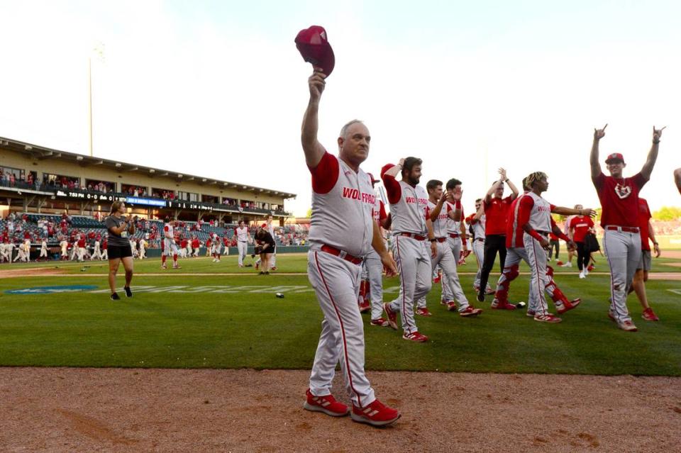 N.C. State coach Elliott Avent acknowledges the crowd after beating Arkansas 3-2 to advance to the College World Series during an NCAA college baseball super regional game Sunday, June 13, 2021, in Fayetteville, Ark.