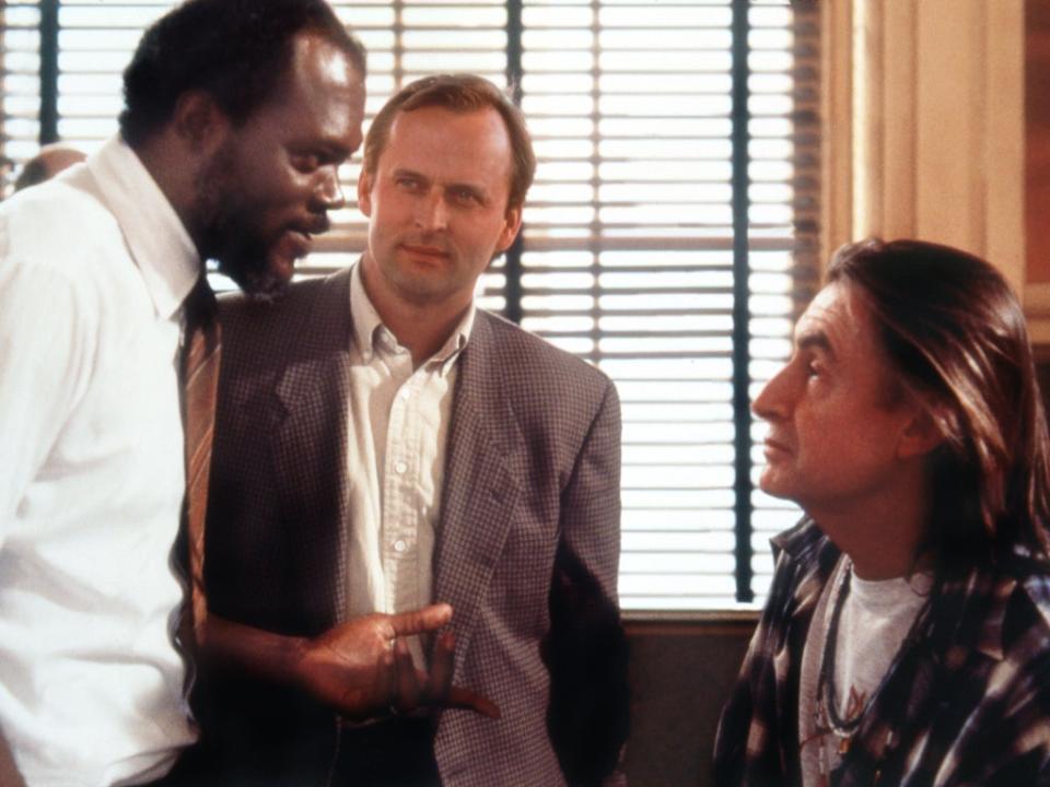 John Grisham (centre) watches Samuel L Jackson and director Joel Schumacher on the set of ‘A Time to Kill' (Moviestore/Shutterstock)