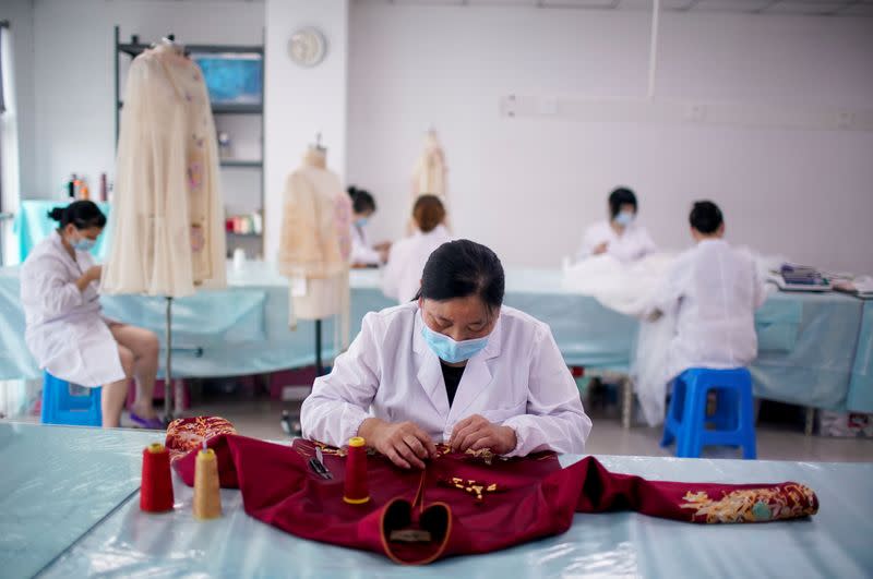 The Wider Image: Coronavirus dampens celebrations in China's wedding gown city