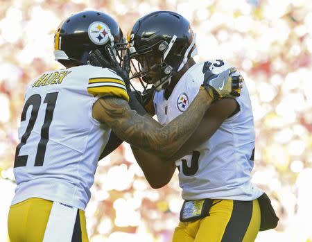 Oct 15, 2017; Kansas City, MO, USA; Pittsburgh Steelers safety Robert Golden (21) and safety Mike Mitchell (23) celebrate in the first half of the game against the Kansas City Chiefs at Arrowhead Stadium. Mandatory Credit: Jay Biggerstaff-USA TODAY Sports