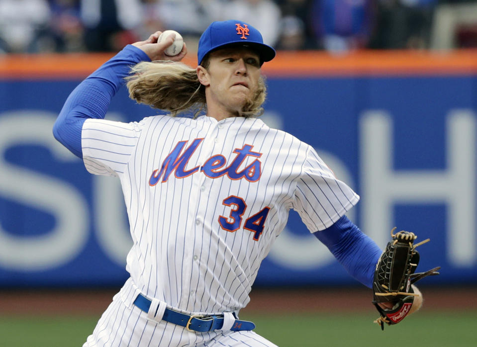 Mets' star Noah Syndergaard struck 10 Cardinals on opening day, meaning one fan had to dye his hair blond. (AP)
