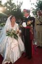 <p>Queen Rania's short-sleeve gown also featured a collar and gold embroidery. She even matched the dress to the details on her veil and shoes.</p>