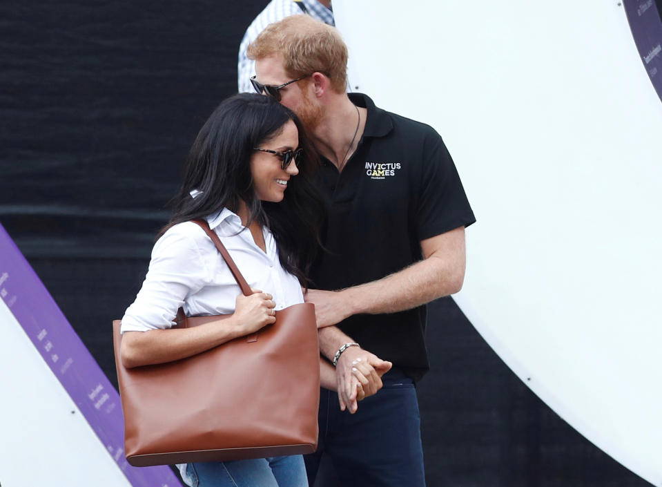 Britain's Prince Harry (R) arrives with girlfriend actress Meghan Markle at the wheelchair tennis event during the Invictus Games in Toronto, Ontario, Canada September 25, 2017.   REUTERS/Mark Blinch     TPX IMAGES OF THE DAY