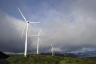 FILE - Wind turbines work on June 25, 2023, in Kodiak, Alaska. The IEA’s annual world energy outlook, which analyzes the global picture of energy supply and demand, was released Tuesday, Oct. 24. (AP Photo/Joshua A. Bickel File)