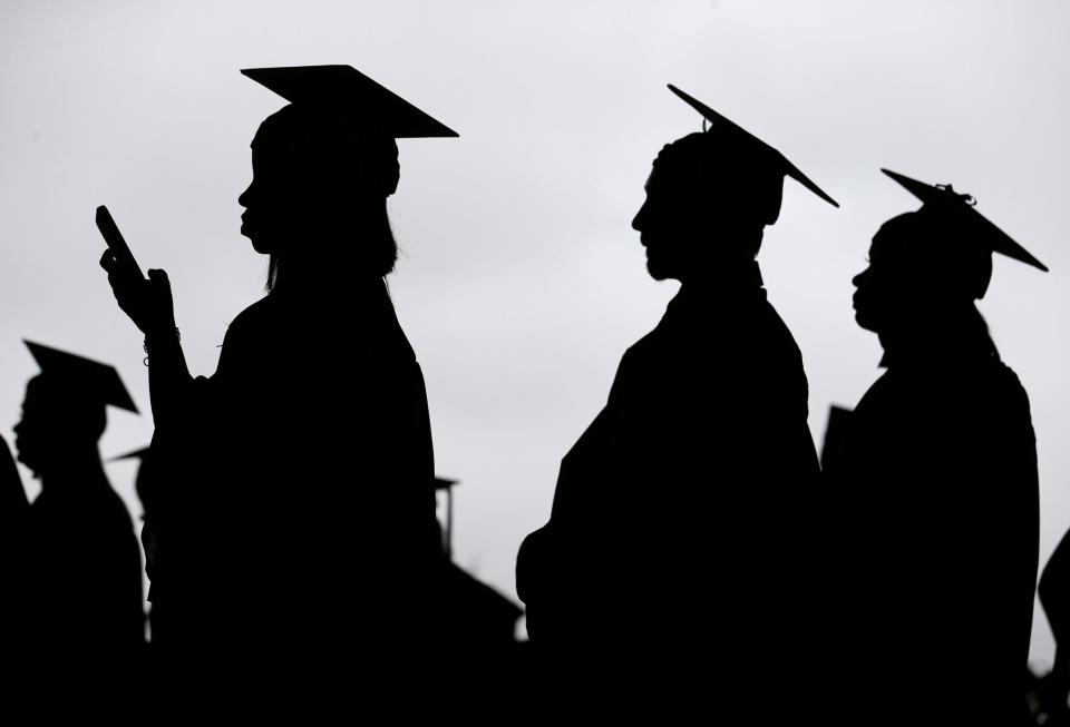 New graduates line up before the start of the Bergen Community College commencement at MetLife Stadium in East Rutherford, N.J.