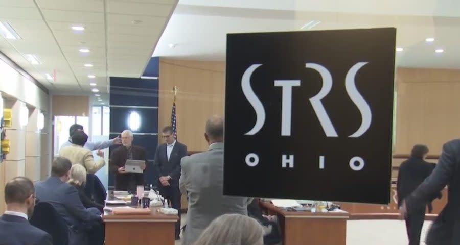 The STRS logo appears on a window during a board meeting on April 18, 2024, when Wade Steen arrived to reclaim his chair. (NBC4 Photo/Mike Klug)