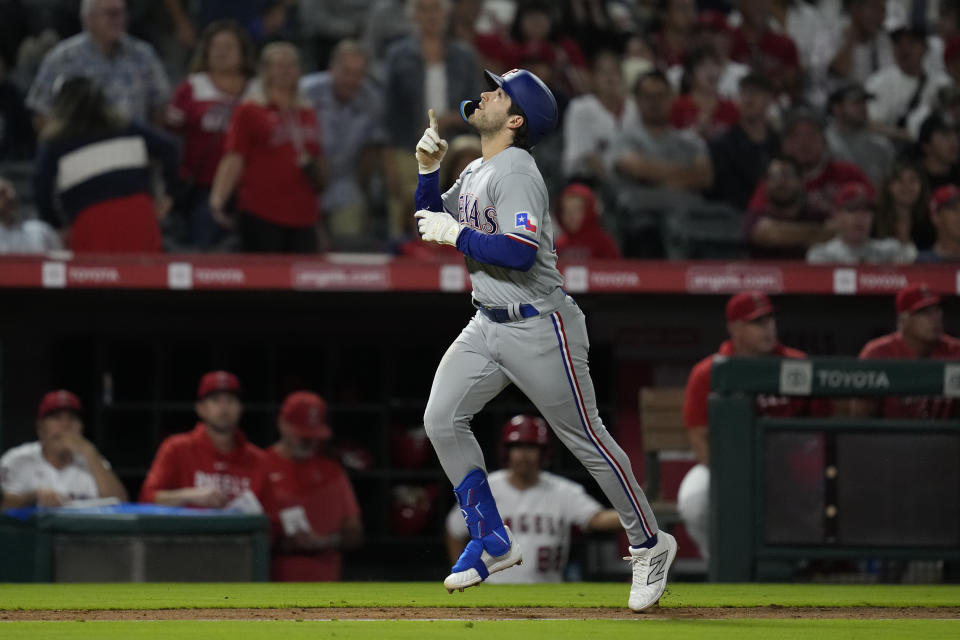 Texas Rangers' Josh Smith (47) runs the bases after hitting a home run during the ninth inning of a baseball game against the Los Angeles Angels in Anaheim, Calif., Tuesday, Sept. 26, 2023. Austin Hedges also scored. (AP Photo/Ashley Landis)