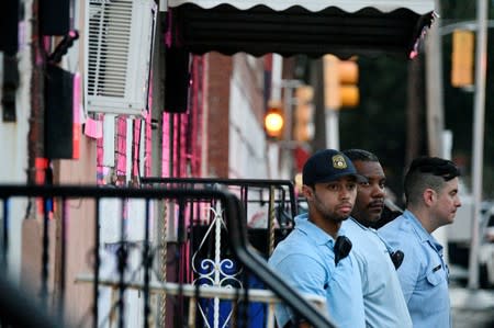 Police stand near the scene during an active shooter situation in Philadelphia