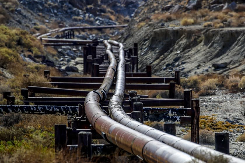 Trona, CA - July 26: Rusty old water pipes, owned by Searles Valley Minerals, snakes through Poison Canyon along Highway 178, on Monday, July 26, 2021 in Trona, CA. (Irfan Khan / Los Angeles Times)